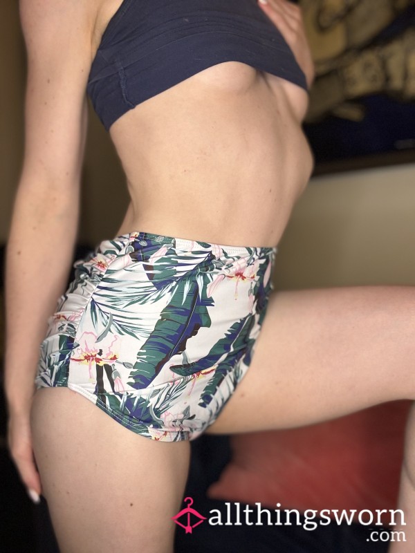 A Very High Waisted Pair Of Swim Bottoms That Are Flor*l