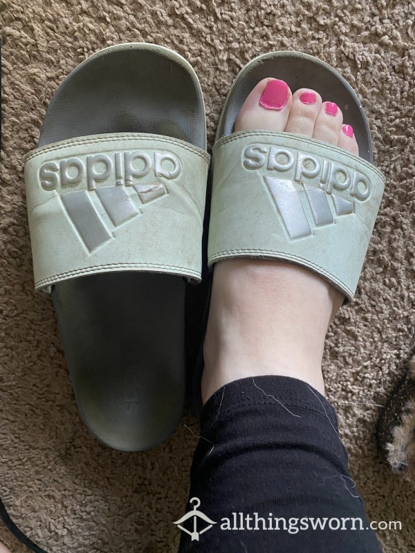 Well-worn Adidas Slides