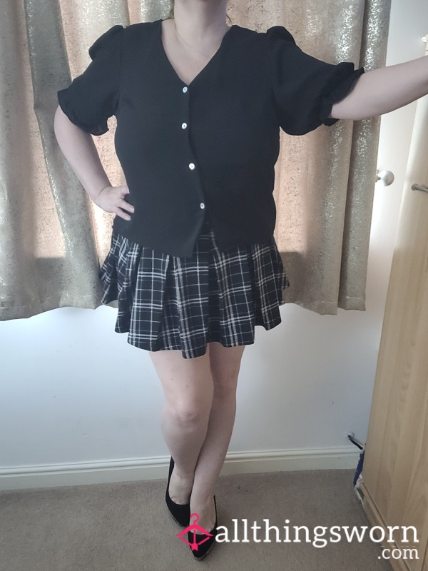 Black Blouse And Pleated Skirt