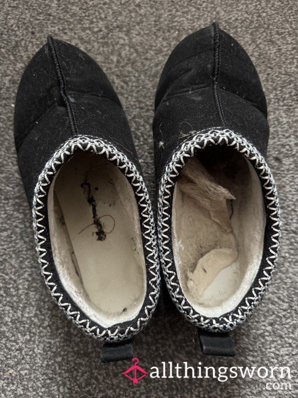 Black Well Worn Slippers.