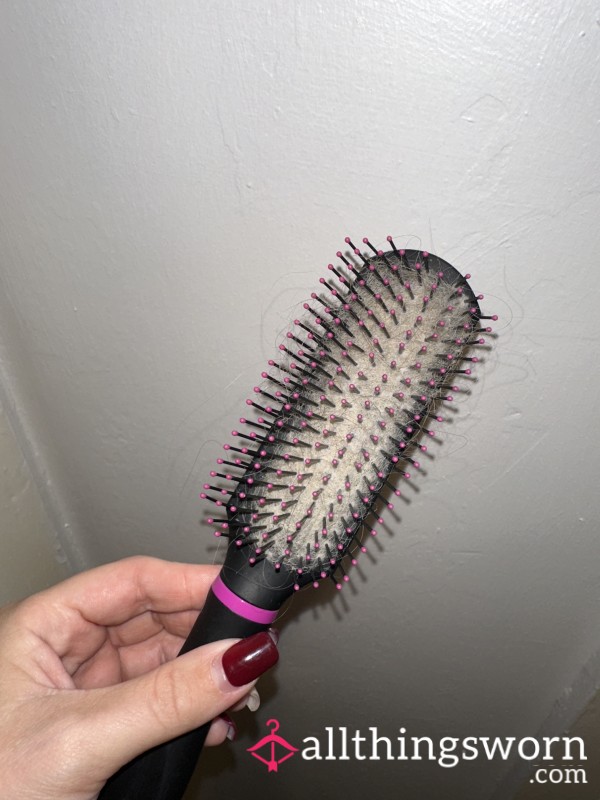 Blonde & Brown Hair In A Pink And Black Hairbrush