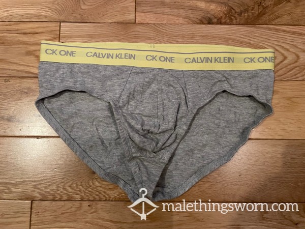 SOLD - Calvin Klein CK ONE Tight Fitting Grey Hip Briefs With Yellow Logo Waistband (M)