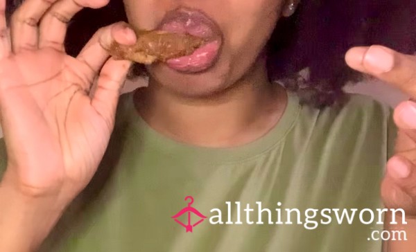 Eating A Plate Of Chicken Wings