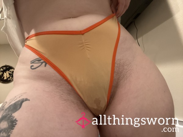 Soft Orange Thong With A Little Golden Wet Spot. Oops 🙊