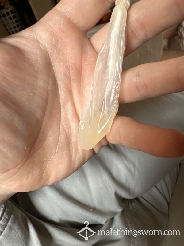 Used And Filled Condom