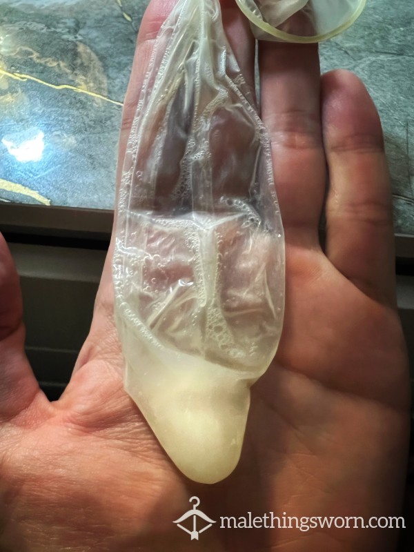 Used Condom Filled With Thick C*m