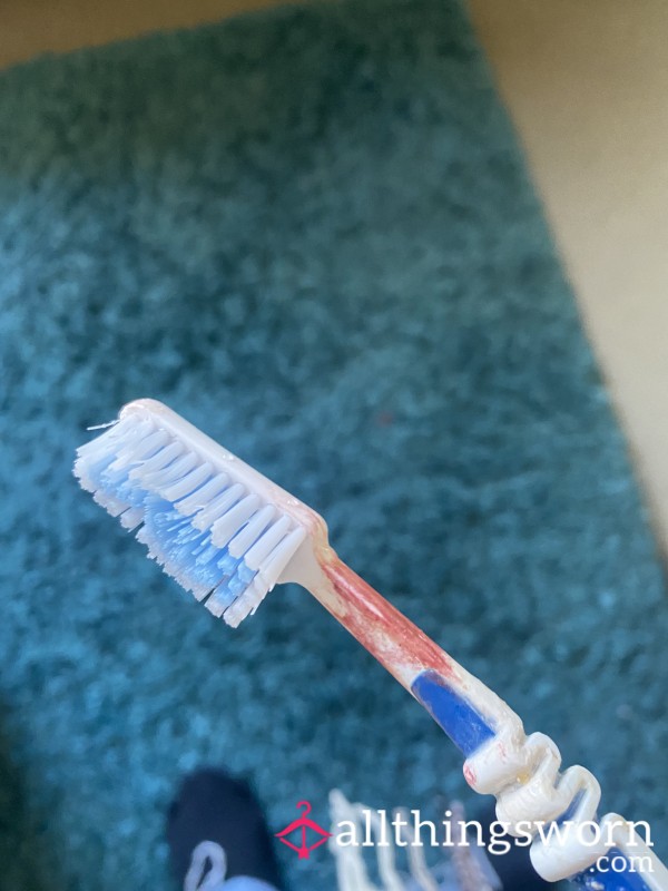 Used Toothbrush With Lip Stick On