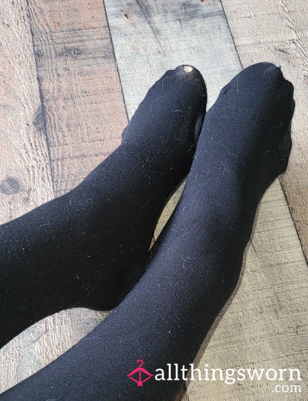 Very Used Thermal Black Pantyhose With A Hole At The Toe