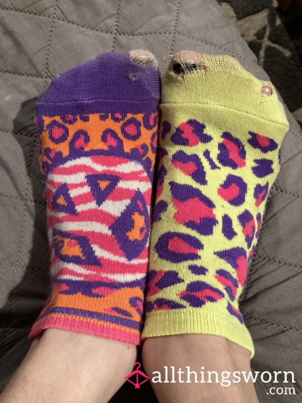 Very Well-Worn Mismatched Socks With Holes