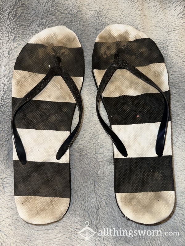 VERY WORN FLIP FLOPS