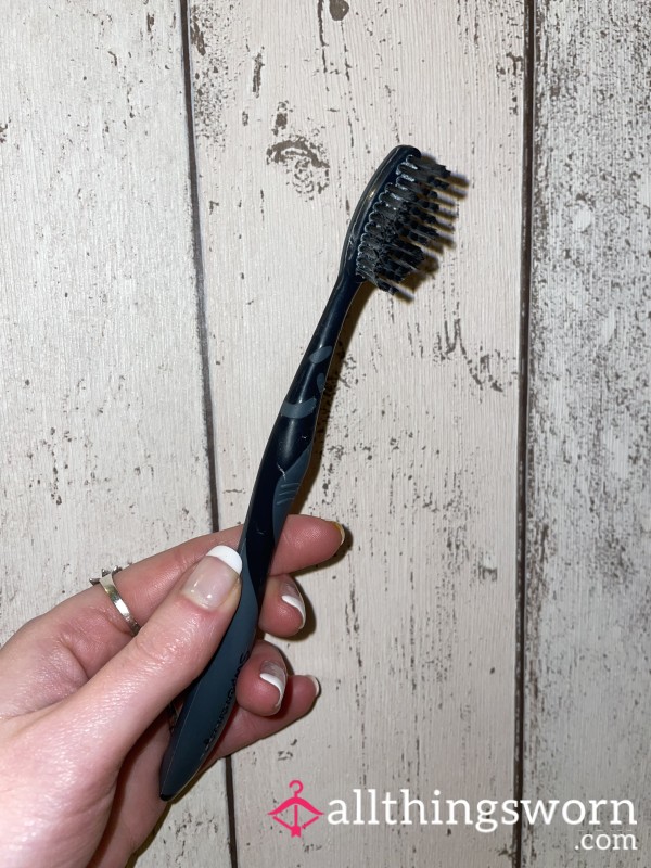 Well Used Black Toothbrush