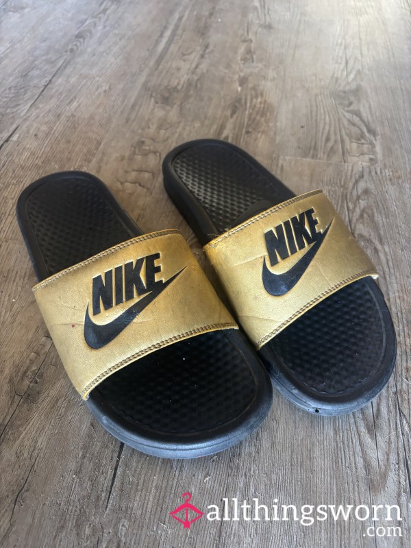 Well Worn Gold And Black Nike Slides