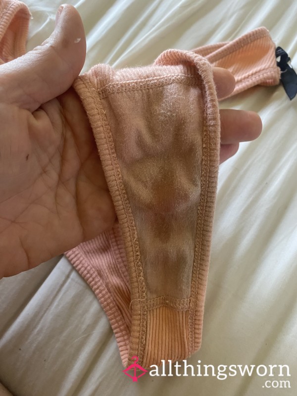 Well-worn Peach Thong With Some Daily Pu**y Juice