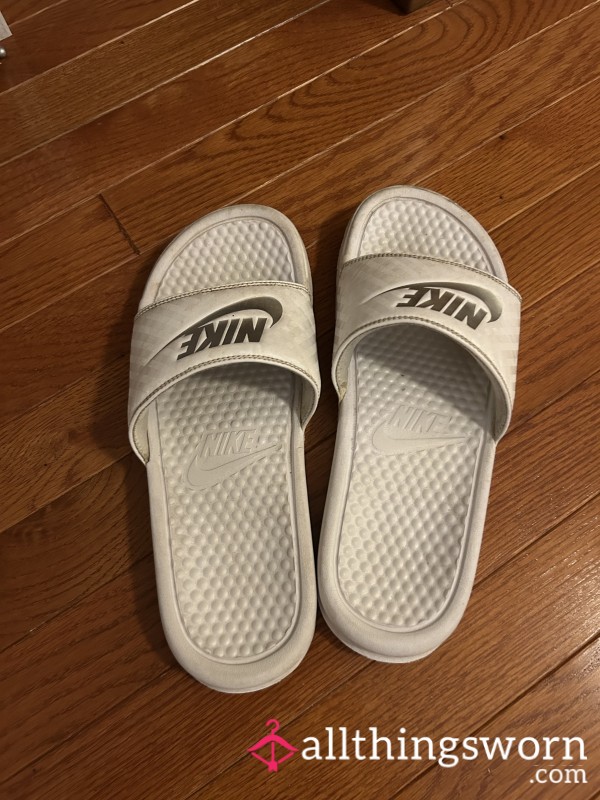 Well Worn White Nike Slides