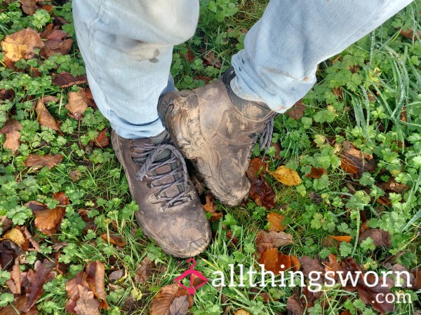 Workboots And Feet In Autumn Leaves