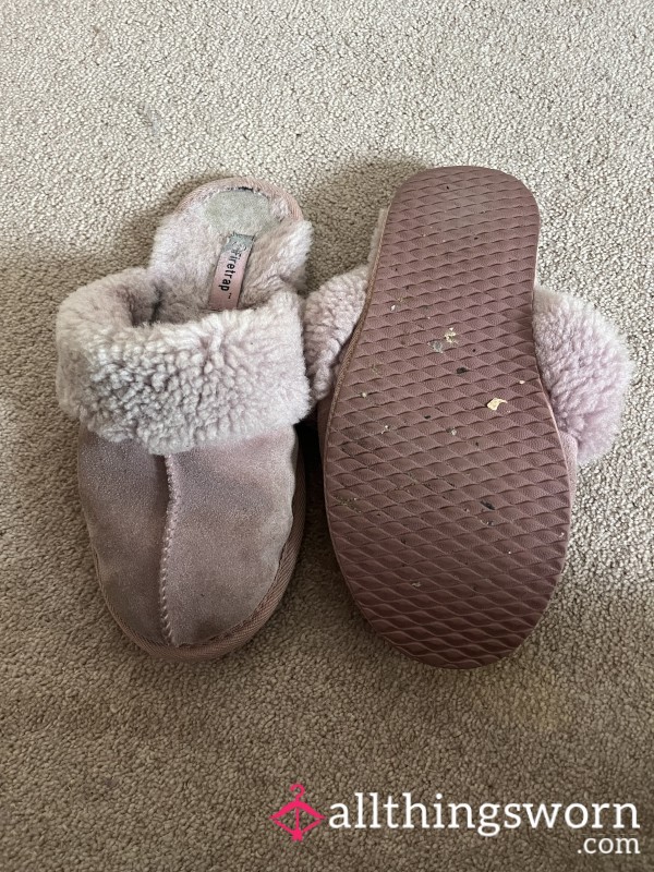 Worn Out Sheepskin Slippers