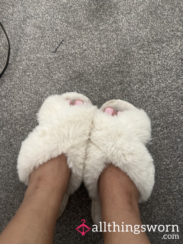 Worn Slippers With Footprint